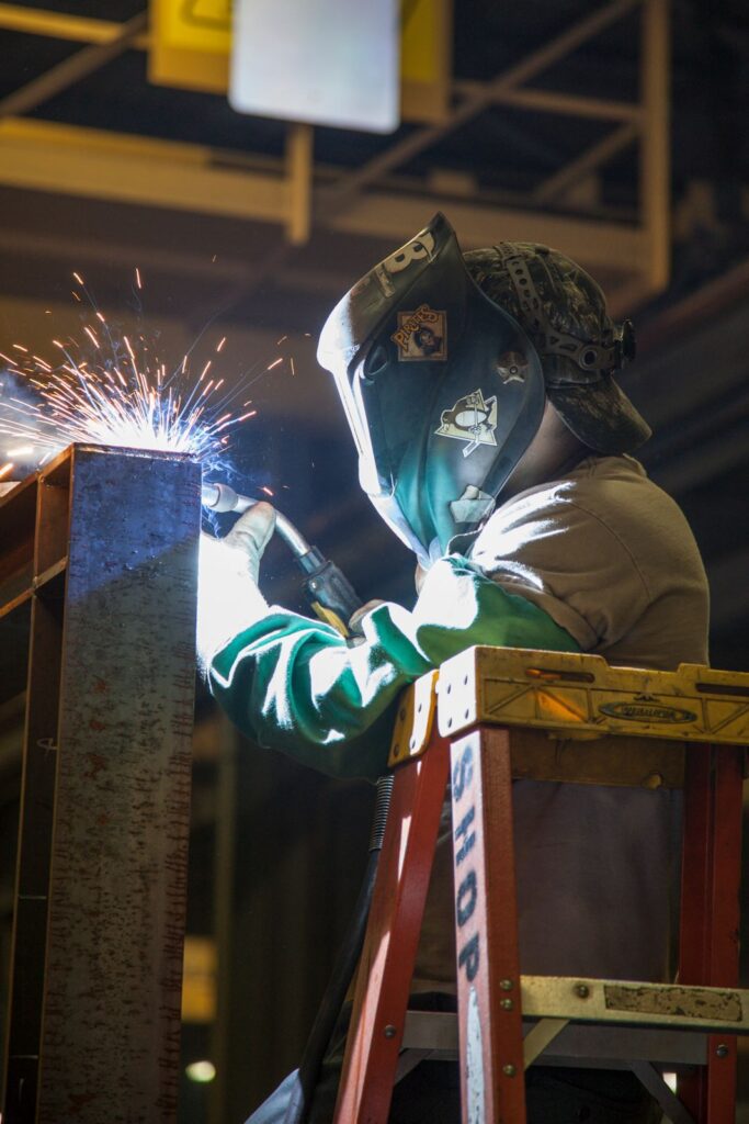 person welding metal